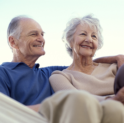 Elder couple sitting in hammock