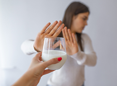 Woman pushing milk away