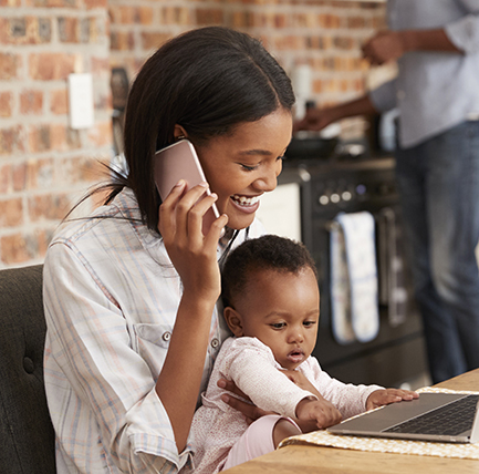 black woman with baby on phone