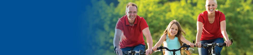 Happy family riding bikes.