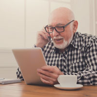 An image of an older guy with a tablet