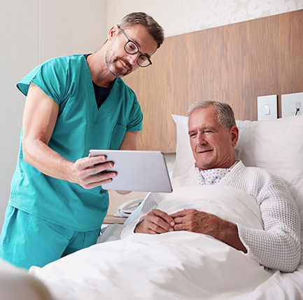 Photo of nurse and patient discussing cardiac rehabilitation