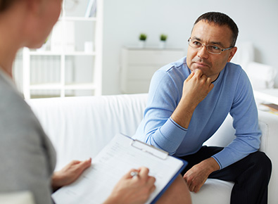 Man speaking with a therapist