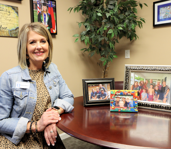 breast cancer survivor with family pictures