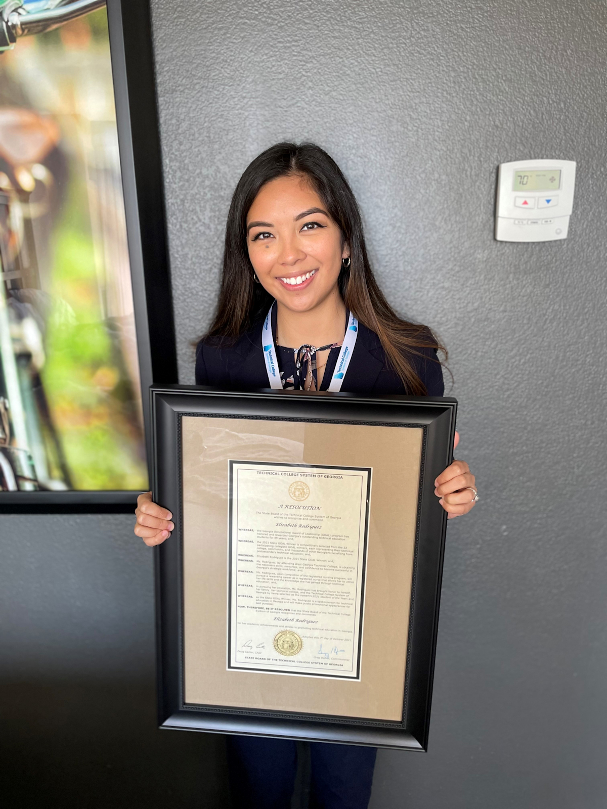 Elizabeth Rodriguez, RN, with her proclaimation for winning the GOAL award.