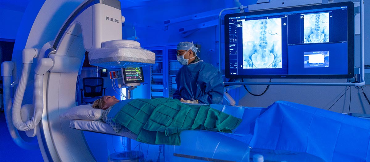 Doctor looking at patient in surgery room