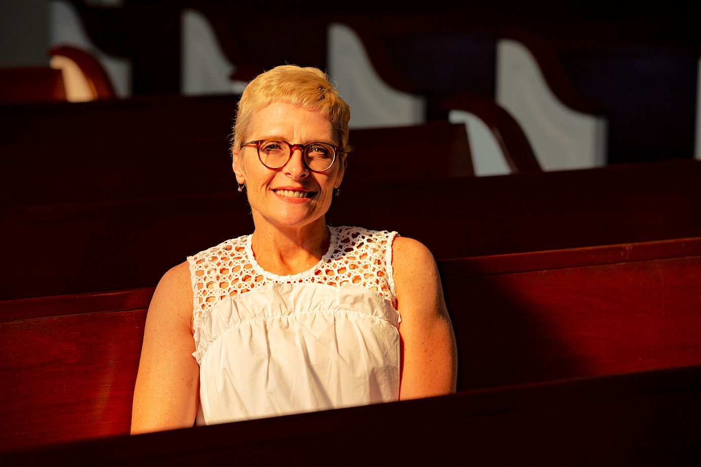 Kimberly Farmer in church pew