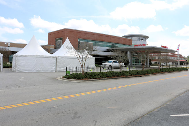 A surge tent in front of Tanner Medical Center Carrollton