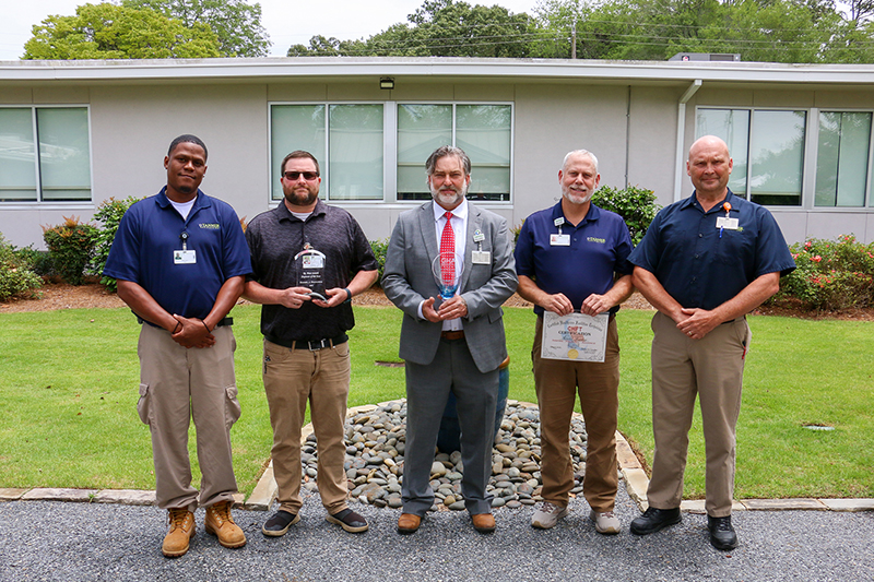 Higgins General Hospital engineering team posing with their award