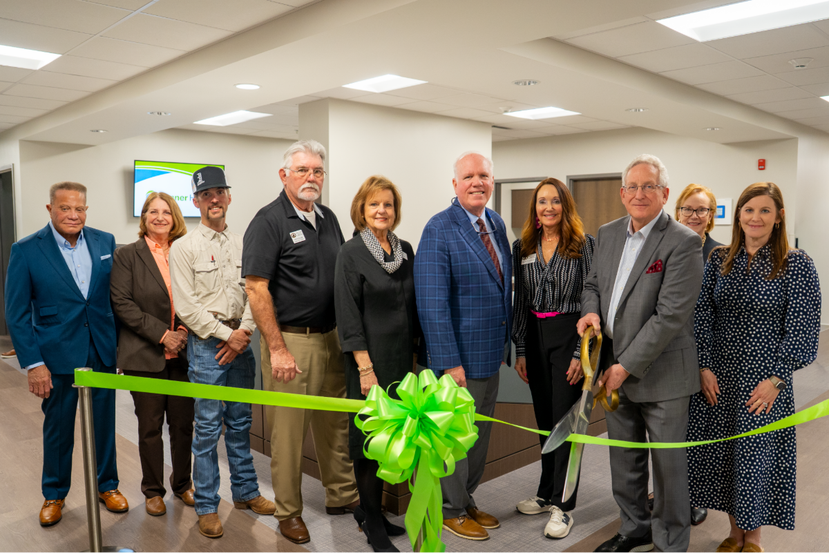 A photo of Tanner board members at the open house ribbon cutting ceremony