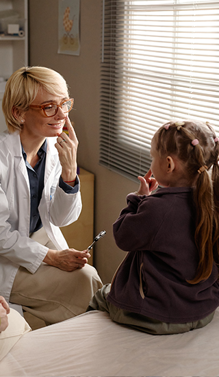 Pediatrician and child talking