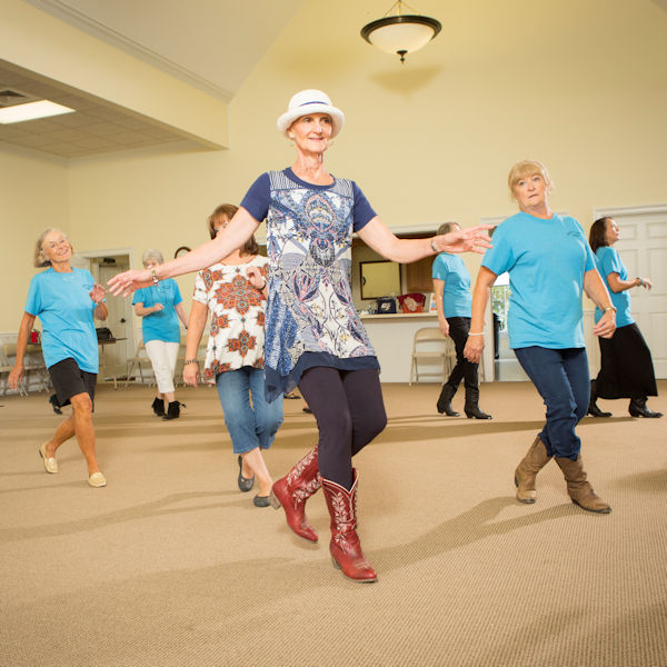 Cherry Ward line dancing with friends