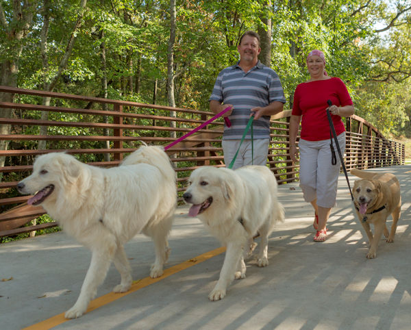 Julie Acree with husband and dogs on GreenBelt