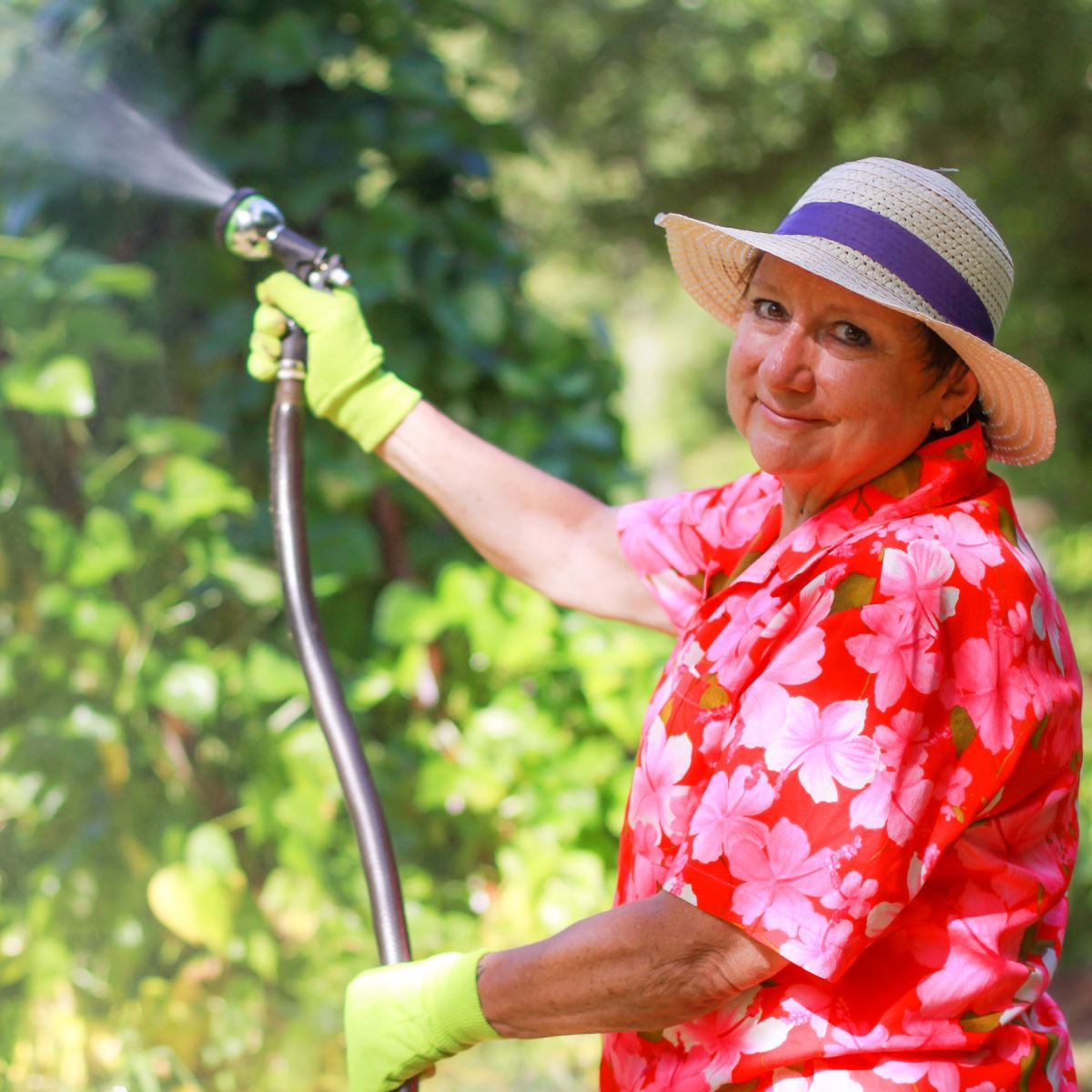 Mary Kong with garden hose