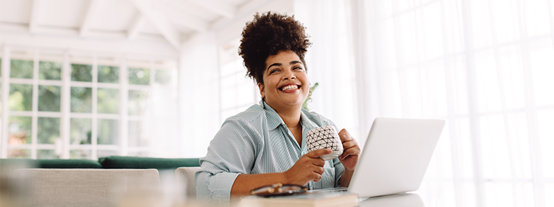Woman smiling at the computer